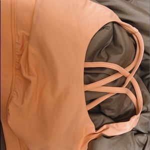 2 lululemon sports bras pink is size (12) and the multi color is size (8)